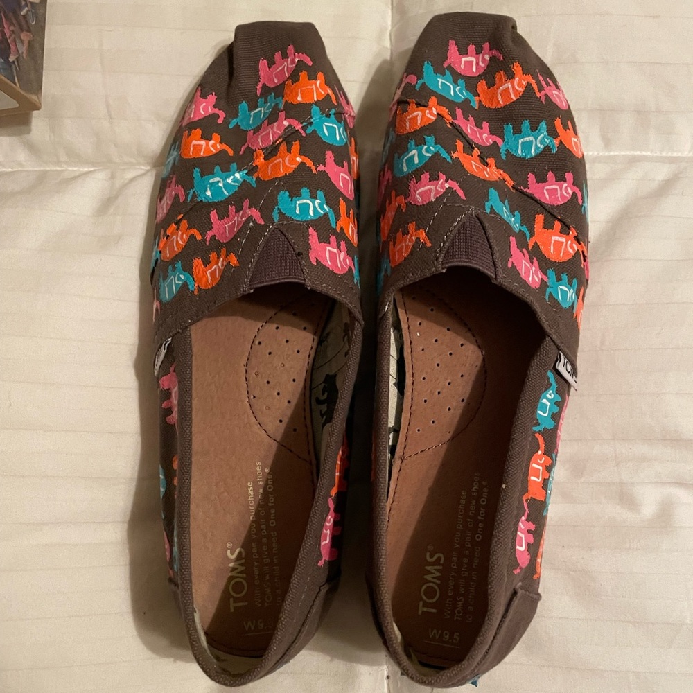 Toms. Worn slightly as shown